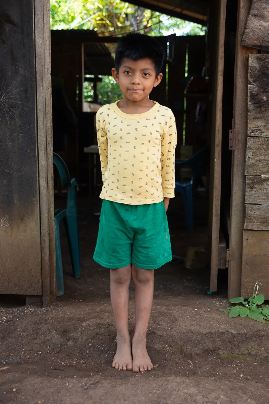 A boy standing in a doorway